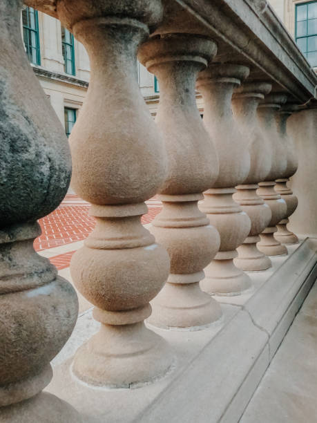 Architectural detail colonnade within the Illinois State Capitol Complex in Springfield, Illinois, USA Beautifully ornate stone detail found on the southeast corner of the Illinois State Capitol Complex in Springfield, Illinois. A light dusting of snow, shot taken on a winter afternoon. illinois state capitol stock pictures, royalty-free photos & images