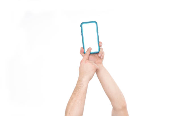 Male hand holding blank smart phone isolated on white background