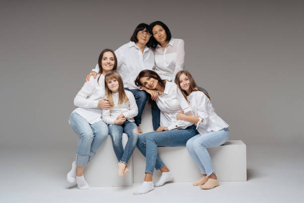 istock Women of three generations posing on gray 1365233322