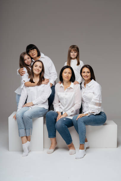 istock Women of three generations posing on gray 1365233333