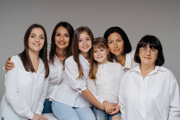 istock Women of three generations posing on gray 1365233342