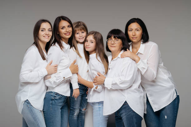 istock Women of three generations posing on gray 1365233347