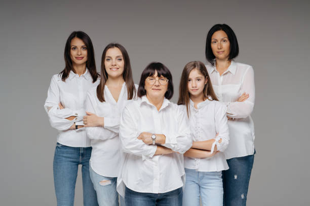 istock Women of three generations posing on gray 1365233388