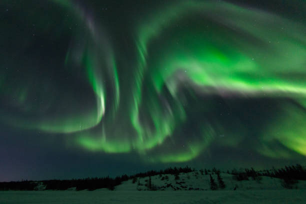 Angel wings of Aurora Borealis in Canada Multiple bright curtains of Northern lights on a clear night over frozen ground, Northern Territories, Canada 3381 stock pictures, royalty-free photos & images