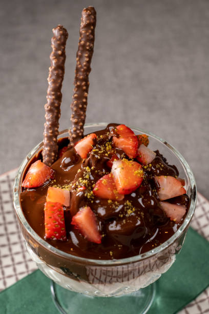 Delicious magnolia dessert with strawberry in glass