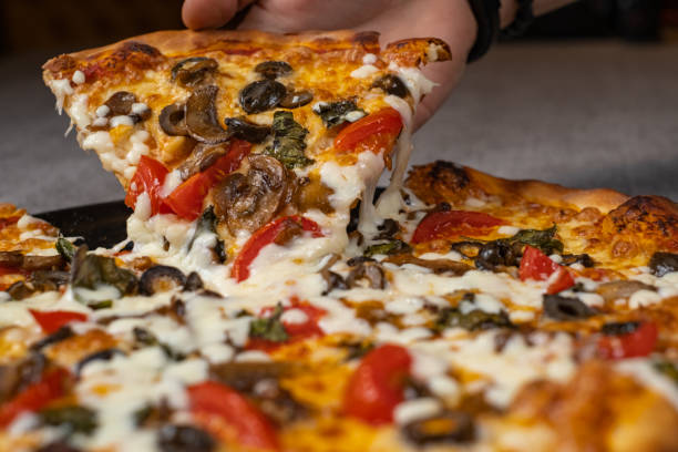 istock Slice of melted cheese pizza 1365238534