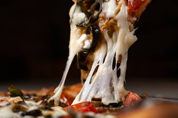 istock Slice of melted cheese pizza 1365238535