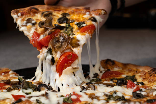 istock Slice of melted cheese pizza 1365238538