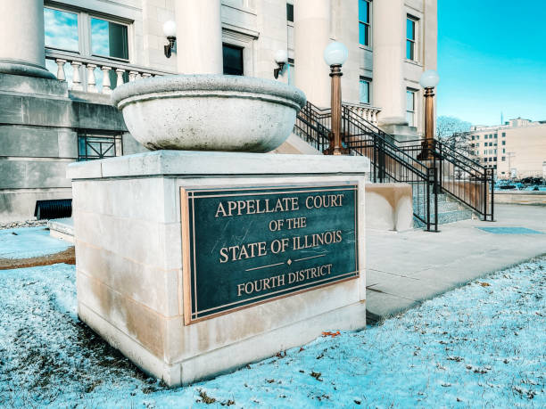 Appellate Courthouse of the State of Illinois Fourth District front facade and placard. Low angle front view of the Appellate Courthouse Fourth District in Springfield, Illinois, USA. Taken after snowfall on a Winter afternoon. springfield illinois skyline stock pictures, royalty-free photos & images