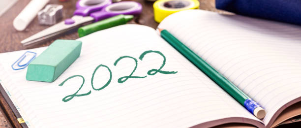 istock school notebook with copy space, written date 2022, back to school concept 1365247504