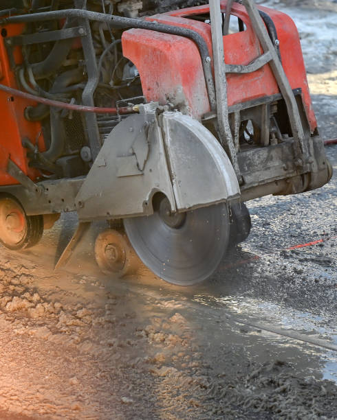 istock Asphalt saw cutting machine running closeup 1365249527