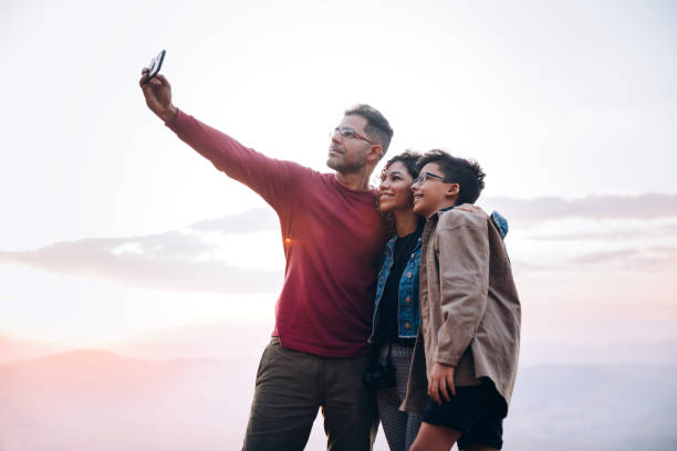 istock Family taking a selfie outdoors 1365253299