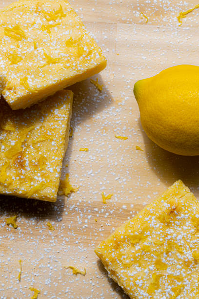 istock Flat Lay of baked lemon bars and fruit 1365257544