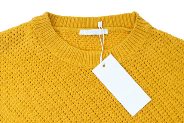 istock White blank rectangular clothing tag on yellow knitted sweater isolated on white background 1365258338