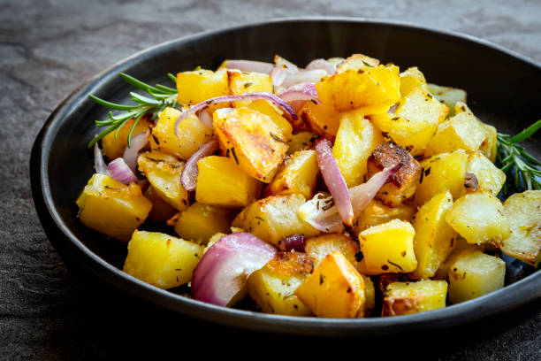 istock Roasted Potatoes with Red Onions and Rosemary 1365258657