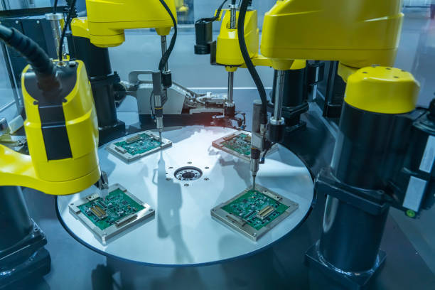 istock automatic robot for print circuit board (PCB)assembly machine during soldering or welding part 1365259413