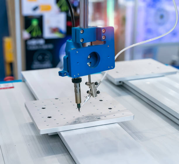 istock automatic robot for print circuit board (PCB)assembly machine during soldering or welding part 1365259428