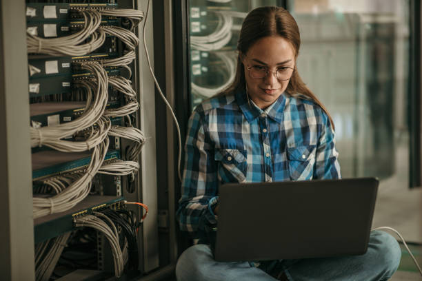 istock Woman in data center 1365261970