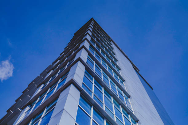 istock Tall building with blue sky and white clouds in the background 1365263243