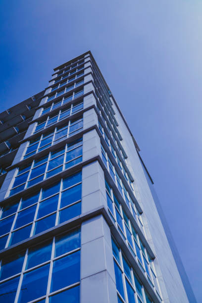 istock Tall building with blue sky and white clouds in the background 1365263248