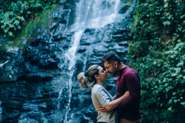 istock Romantic couple at the waterfall 1365264443