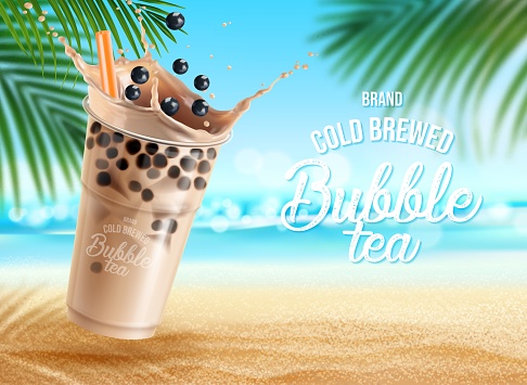 Bubble milk tea with chocolate on summer beach, cold brewed drink background. Bubble tea cup or iced coffee or choco beverage with balls in cocoa milk splash and drinking straw with summer palms