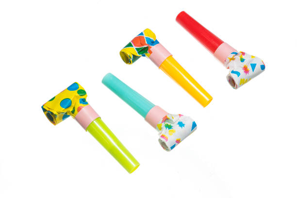 Party blowers on white background stock photo