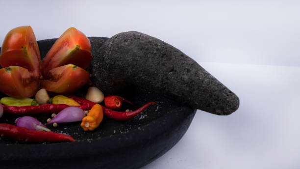 mortar and pestle with fresh spices - mortar and pestle spice seasoning coriander seed imagens e fotografias de stock