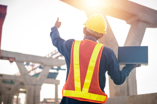 istock engineers use computers to check the quality and plan the construction of large expressways. 1365275369