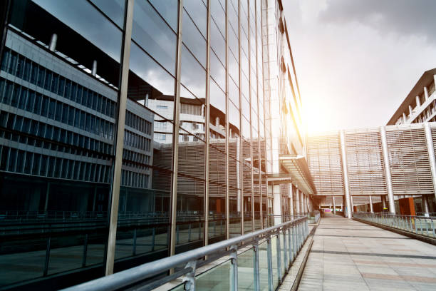 istock Glass wall and empty road in office park 1365276373