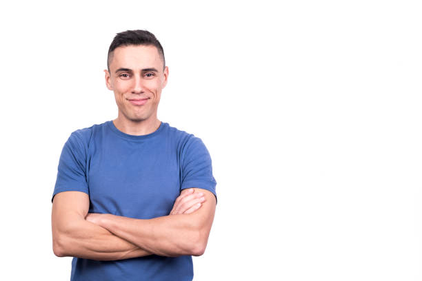 istock Man standing with arms crossed and proud expression 1365276932