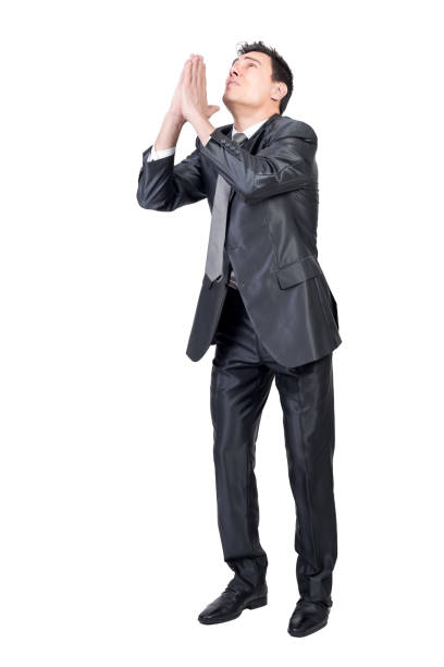 istock Hopeless well dressed man begging for support 1365278710
