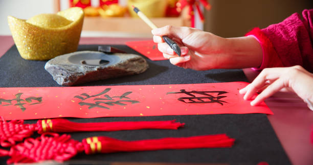istock Writing spring festival couplets 1365279897