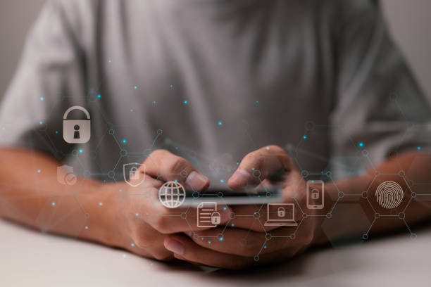 istock Man use smartphone. Online data protection and information cyber security concept. 1365280655