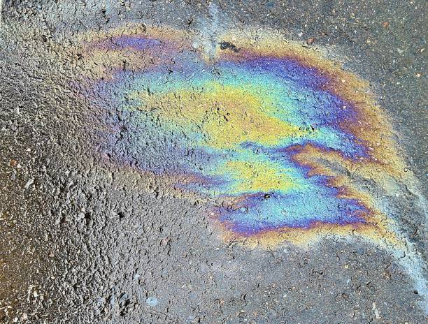 istock Eco concept, oil spill on asphalt road 1365283682