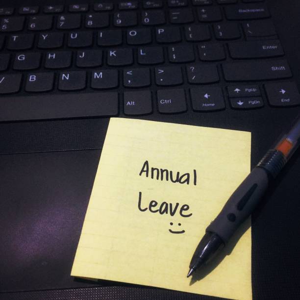 The concept of writing in a note that reads Annual Leave.