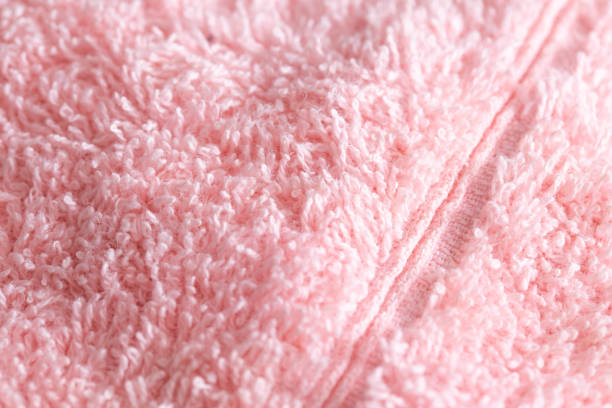 istock Texture background fabric with pile. Pink soft cloth, macro 1365291797