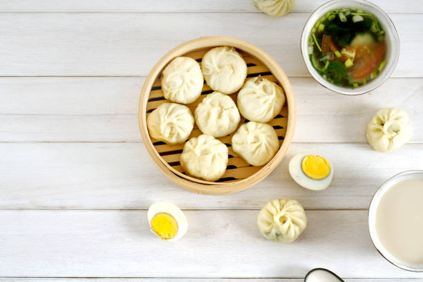 A big breakfast, boiled eggs, vegetable soup, steamed stuffed buns