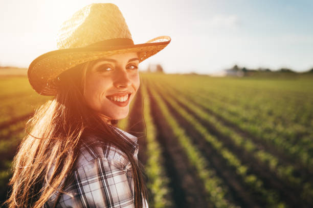 istock woman farmer on field 1365294714