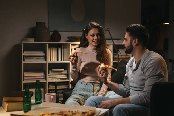 istock friends enjoying time together at home 1365294951