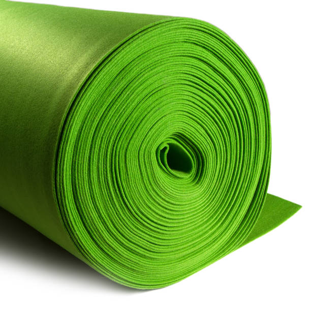 istock A roll of green fabric on a white background. 1365295161
