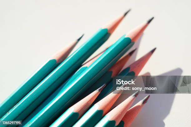 Green Set Of Graphite Pencils On Sunny White Table Stock Photo - Download Image Now - Abstract, Backgrounds, Close-up
