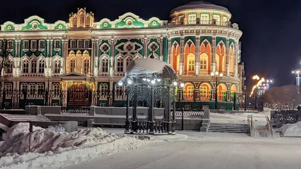 Sevastyanov house is a historical building in neo-gothic style, the most famous architectural building in historical centre of the city Yekaterinburg. Winter night. Walking in the city. Blurred focus