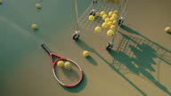 istock Tennis equipment on concrete court. 1365299731