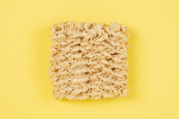 istock Instant noodles on yellow background 1365299807