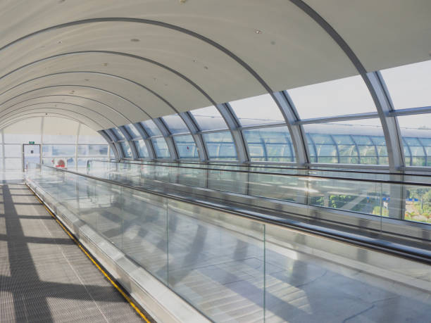 Clean white modern futuristic moving walkway Clean white modern futuristic moving walkway airport travelator stock pictures, royalty-free photos & images