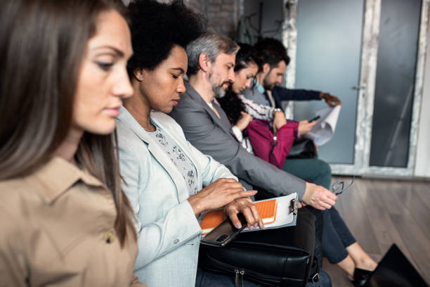 istock Business people waiting for job interview. 1365305349