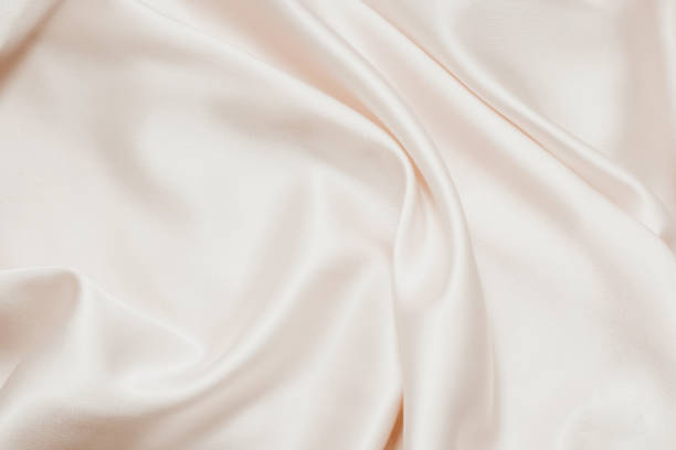 istock Nude silk texture. Satin delicate powdery glitter finish, beautiful backdrop for designers 1365306729