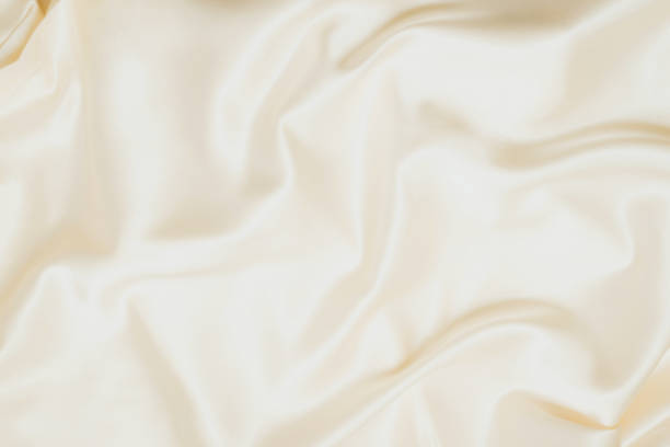 istock Golden silk texture. Satin delicate shiny finish, beautiful backdrop for designers 1365306757
