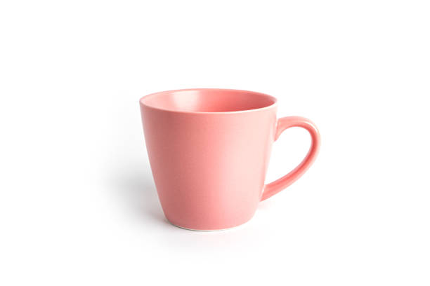 istock Pink tea cup for drink isolated on white background. Ceramic coffee cup or mug close up 1365307052
